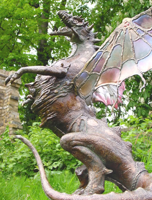 Magnificent limited edition cold cast bronze dragon garden statue. Dragon comes with magic coin