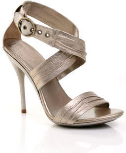 Leather sandal featuring wide bagged straps with cross over detail and ankle buckle. The gorgeous La