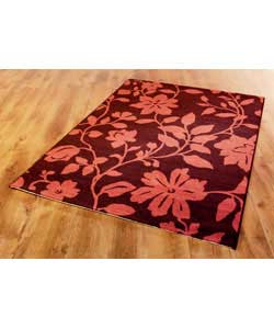Floral design in aubergine and pink.100% olefin fibre.Ends folded and edges bound.Surface shampoo on