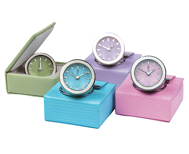 Leather-Case Alarm Clock. A desirable little alarm clock with coloured dial and coordinating lizard-