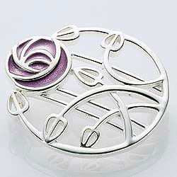 Traditional glass enamel has been used to decorate this exquisite sterling silver brooch in the