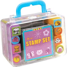 A set of eight miniature rubber stamps with an ink pad - all packed into a transparent suitcase