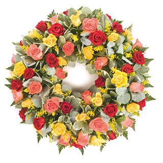 This striking wreath combines three shades of lovely roses with lush green foliages.
