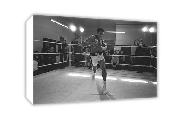 1966 Cassius Clay (Muhammad Ali) glides around the ring for the benefit of the press as he trains in