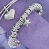 Solid sterling silver multi ring bracelet comes complete with starfish charm plus silver split rings