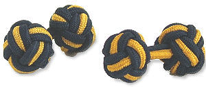A pair of navy and gold elastic knot cufflinks.