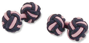 A pair of navy and pink elastic knot cufflinks.