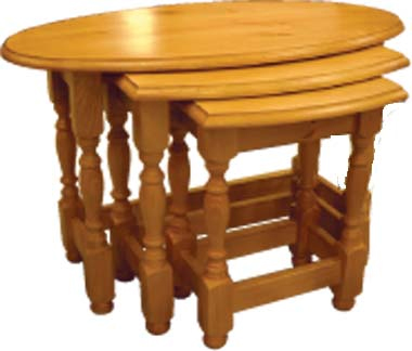 Beautifully designed oval nest of pine tables with ornate turned legs and wonderfully finished