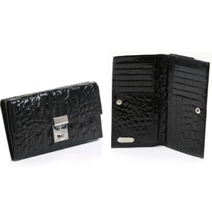 Patent leather purse with all over mock croc effect. Featuring magnetic button fastening closure, cr