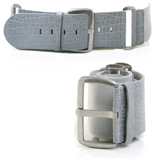 Elastic waist belt featuring mock croc leather trim and large silver coloured buckle detail. The Ocr