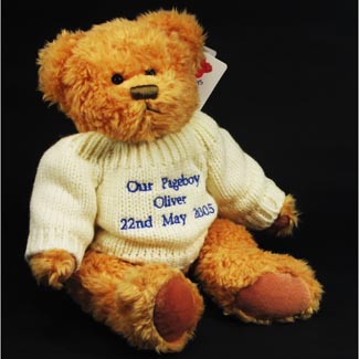 A 30cm high cuddly teddy wearing his own woolly jumper which can be embroidered with your pageboy