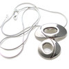 This striking oval sliver of polished and brushed silver is a beautiful reminder that great design n