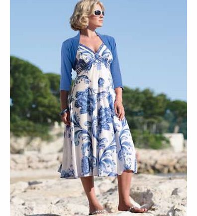 A summer essential! Maxi dress in a stunning floral print. Lovely bead detail on the front and ideal for wearing during the day with sandals, or dress up with matching accessories for a chic evening look. Adjustable straps and fully lined. Pomodoro D