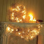 18ins. Gold Scot pine wreath with silver tips and 20 bulb pre-setting lights.  Pictured top