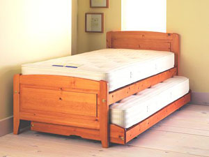 A solid pine storabed, featuring a low foot-foot e