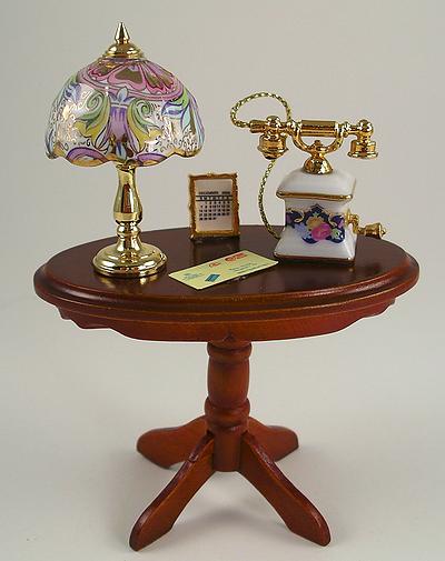 1:12 Scale Reutter Porcelain Walnut Side Table containing a Tiffany Style Porcelain and Brass Lamp