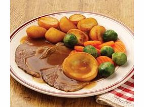 The classic roast dinner  tender steam roasted beef with a Yorkshire pudding and roast potatoes in a rich beef gravy. Served with fluted carrots and Brussels sprouts.