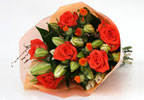 This elegant bouquet comprises pure white Aziatic lilies, vibrant orange roses and bright orange car