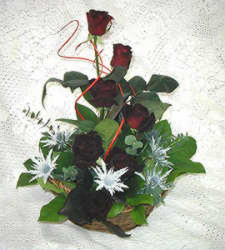 Send this delightful basket of scented flowers. A wonderful selection of Roses, snow thistles,