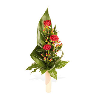 A modern and simple vase arrangement of lush velvety Red Roses and interesting foliages make this ar
