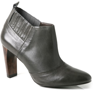 Pointed toe leather ankle boot featuring elastic back and a high wooden heel. Wear the gorgeous Sand