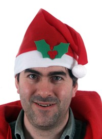A cheerful red hat full of Christmas fun.  Features holly trim and white bobble