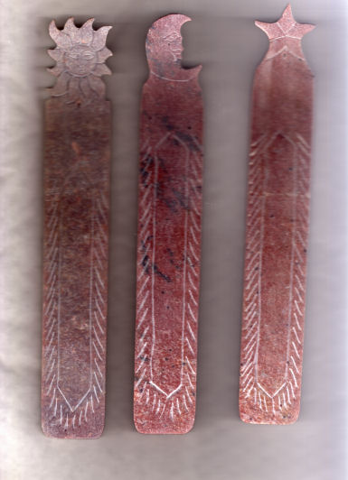 these ash catchers have a sun carved into them at one end and down the middle has a pattern carved