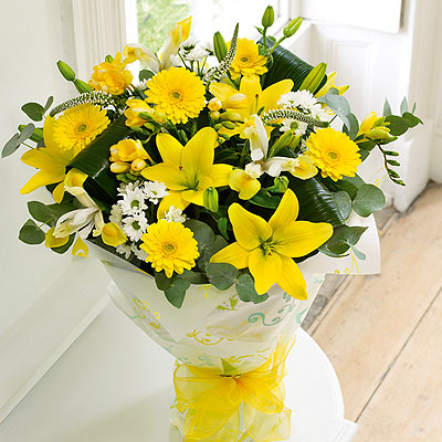 This glorious hand-tied bouquet contains an abundance of superb spring flowers in brilliant lemons a