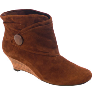 Almond toe suede ankle boot with a low wedge heel. The Suzy boot features ruche and button detail. L