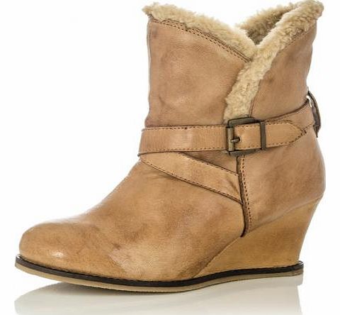 Made with real leather, these wedge style boots are amazingly stylish. Ankle length boots with faux fur lining and a wedge heel, these are a must have to complement your new season style. - Real leather outer - Side zip fasten - Mid heel wedge - Heel