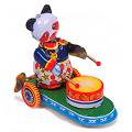 Traditional tin toy. Wind him up and watch him bea