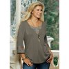 Three-quarter sleeve jersey top with intricate embroidery at the cuff and neckline, giving a double 