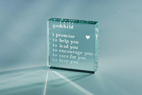 A delightful keepsake from a Godparent, this medium glass paperweight will be appreciated even when 