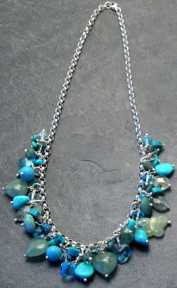 This simply stunning necklace compromises a sterling silver chain decorated with Aventurine (a