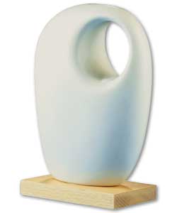 Dolomite abstract art on a wooden base.Size (H)19.5, (W)13.5, (D)7cm