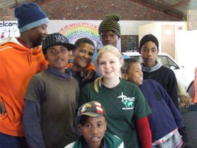 Unbranded Volunteer with children in South Africa