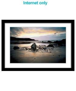 Serene photographic canvas of sunset at Whistling Sands, Porth Oer, Gwynedd. Artist Info: Joe Cornis