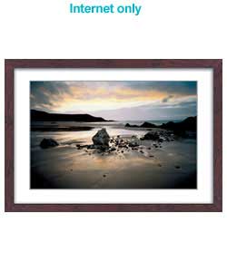 Serene photographic canvas of sunset at Whistling Sands, Porth Oer, Gwynedd. Artist Info: Joe Cornis