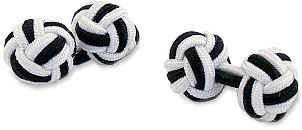 A pair of black and white elastic knot cufflinks.
