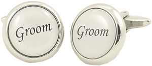 A great set of silver-coloured metal cufflinks with the word Groom in black on a white coated backgr