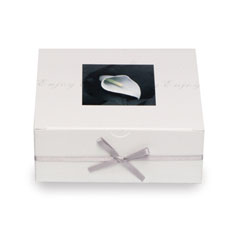 This elegant white favour box with cala lily detail contains four of Thorntons finest Continental ch