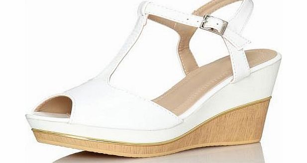 Wedge sandals are summer time favourites. These feature a wood effect wedge heel with patent strap outer. Fantastic to wear with a summer maxi, complete the look with jewellery and a bag for summer evening dining. - Patent strap outer - Wood effect w