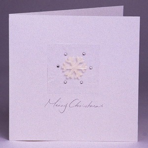 A gorgeous handmade Christmas card with a white velvet snowflake and glistening silver droplets
