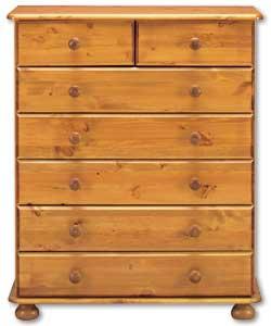 Scandinavian solid pine (except backs and drawer bases) with an antique stain. Turned bun feet and